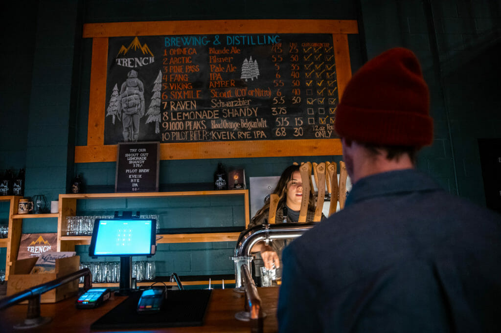 image of Mark Matthews ordering a beer at Trench Brewing & Distilling in Prince George, BC