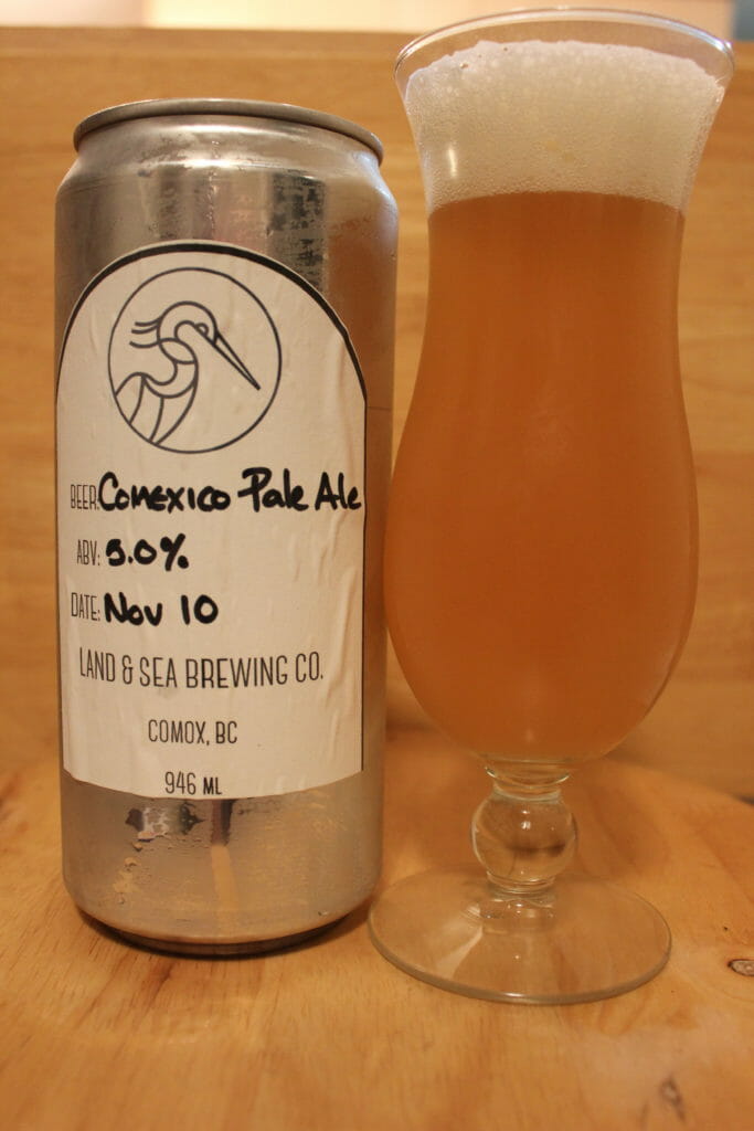 image of 946mL crowler of Land & Sea's Comexico Pale Ale, poured into a beer glass