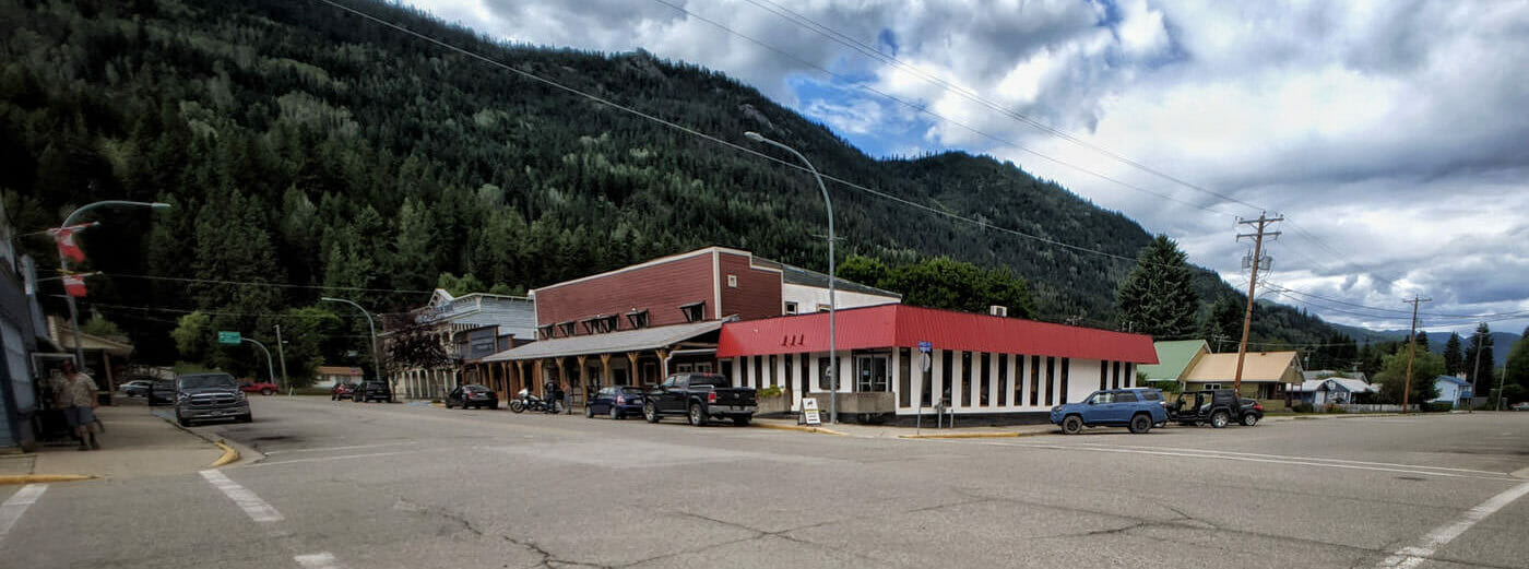 Streetscape view of intersection, brewery, and mountain
