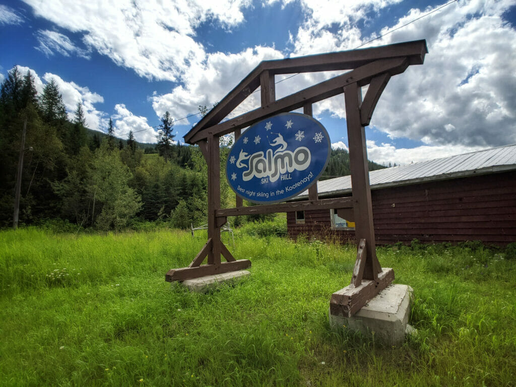 Salmo Ski Hill sign with landscape and sky