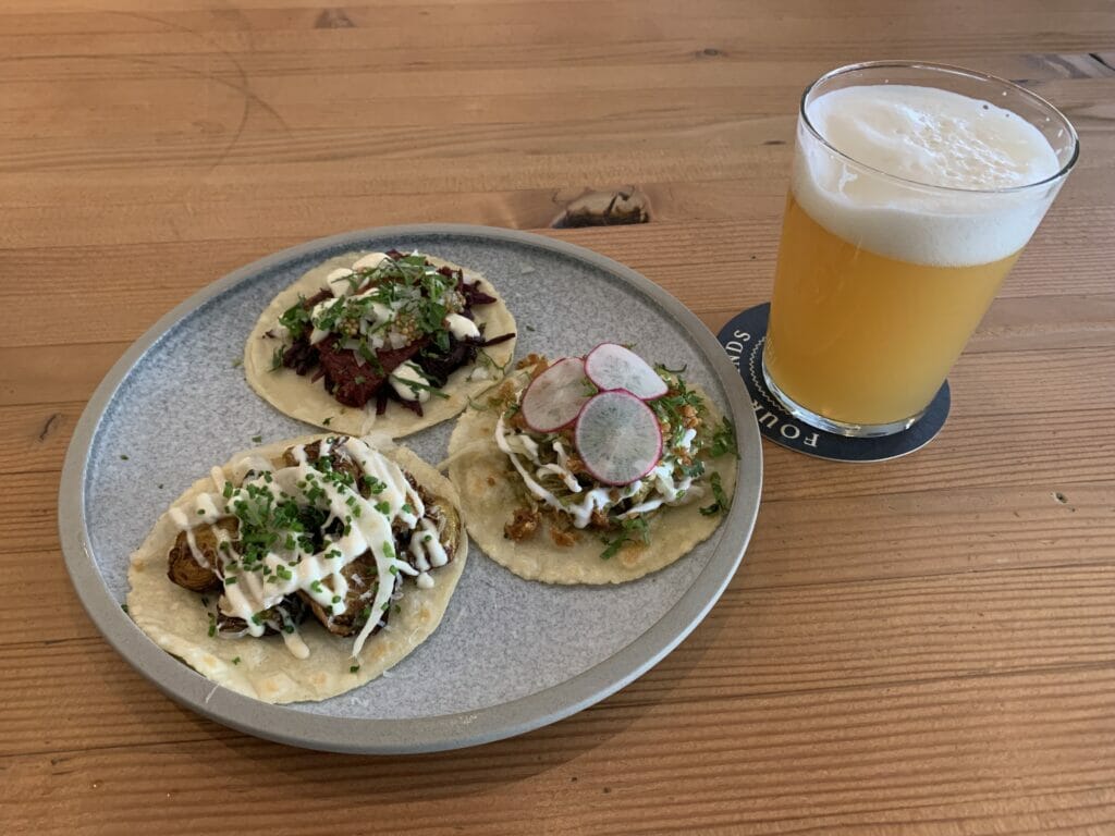 Enjoying lunch of tacos paired with ExtraLux at Four Winds Brewing