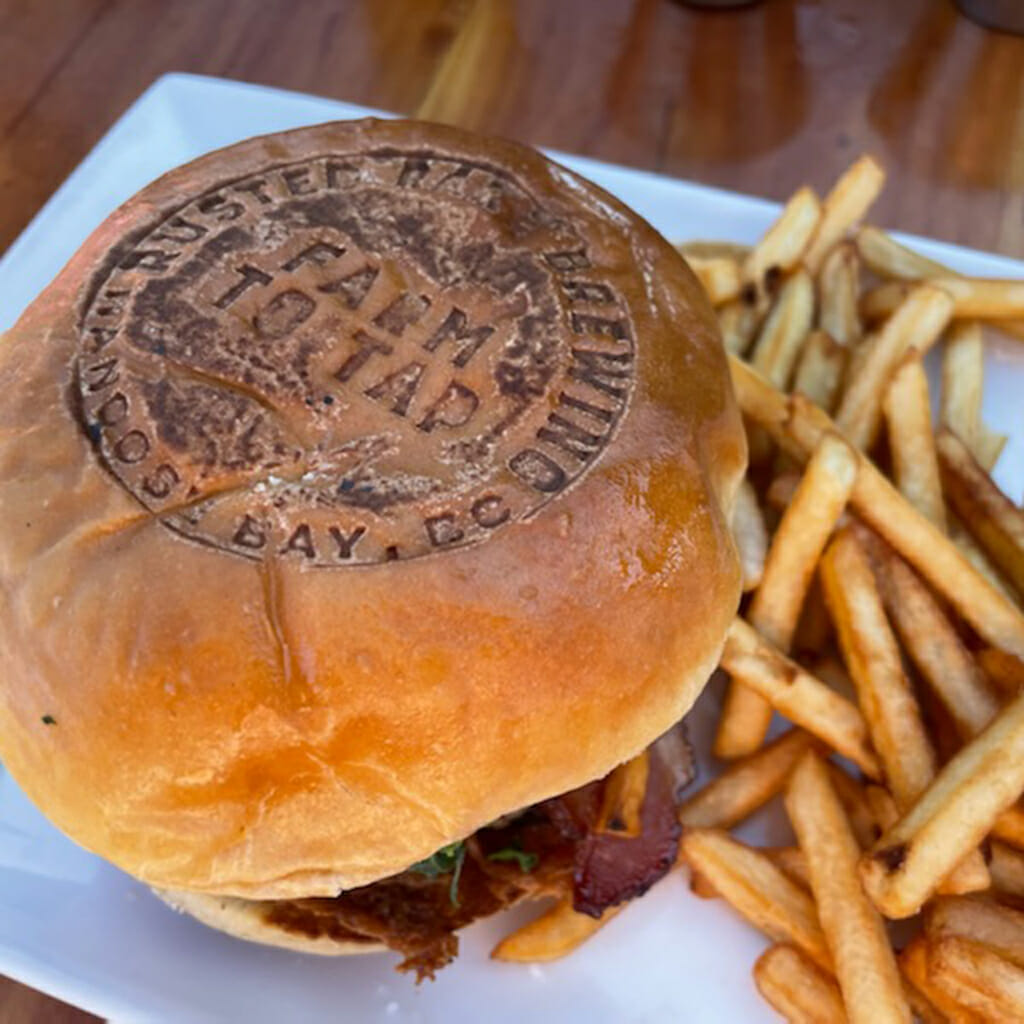 A branded burger and fries from Rusted Rake Brewing