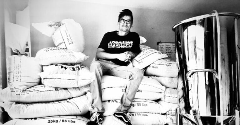Miguel Molina with his first batch of grain at his brewery in Ecuador